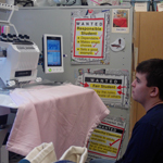 alpha student learning to operate an embroidery machine