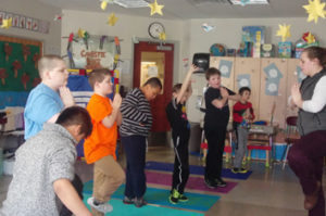 students learning yoga to help their special education needs