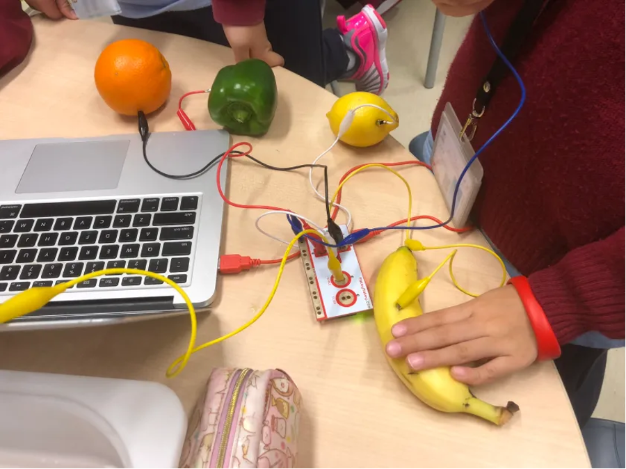 Makey Makey is a small circuit board that turns physical objects (like a banana) into buttons for your computer