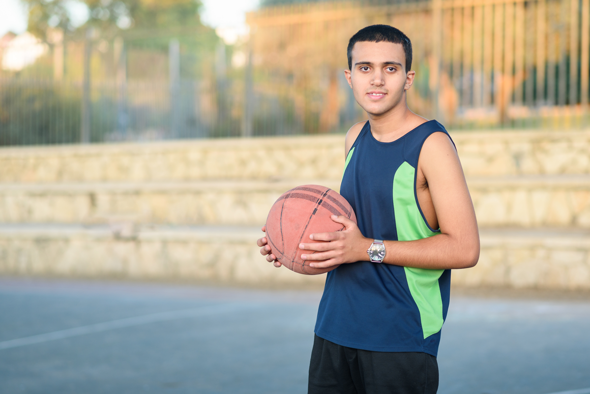 boy with basketball to reduce stress