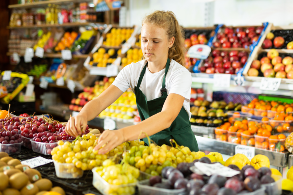 special needs student working in food store