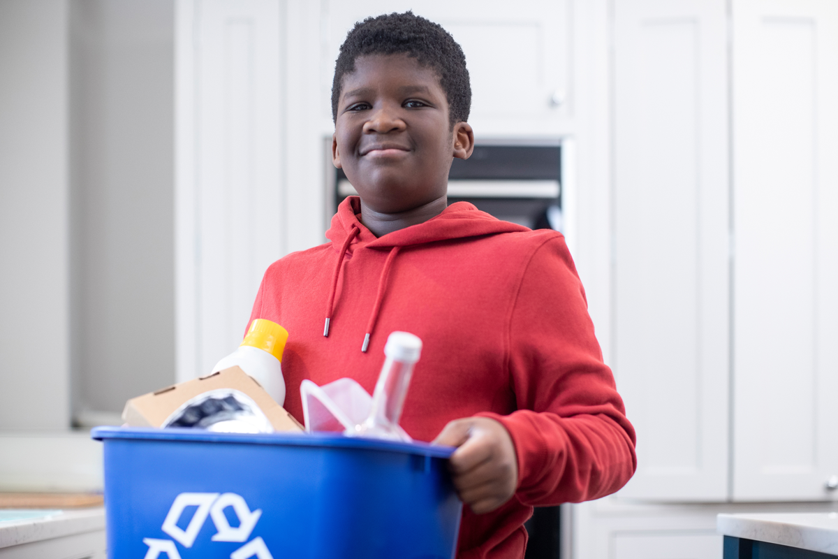 boy taking out trash