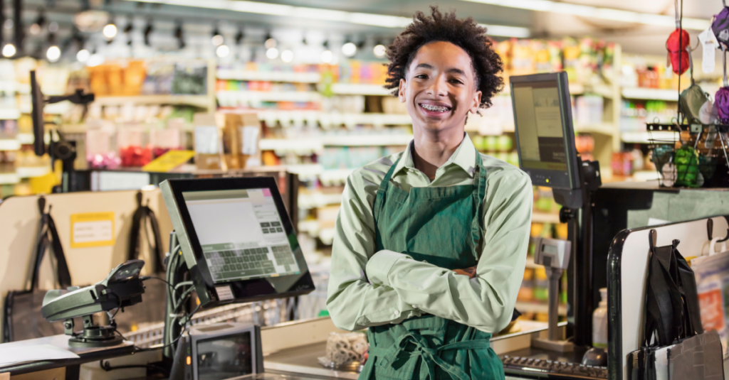 boy working in retail store happy and confident