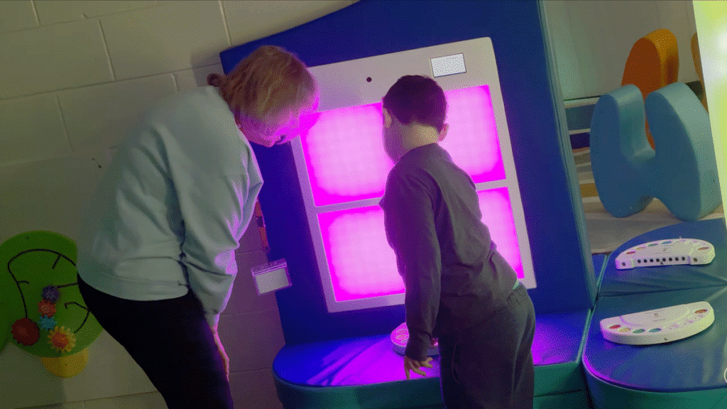Teacher working with a special needs student in a sensory-friendly classroom at Alpha School in New Jersey